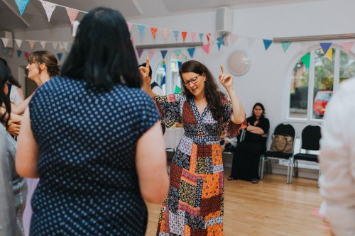 A guest dancing at a wedding at Wren Hall