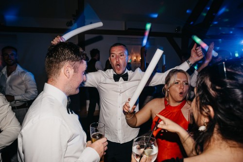 Wedding guests dancing at Mythe Barn