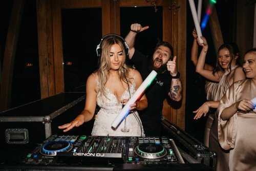 The Bride behind the decks at Mythe Barn