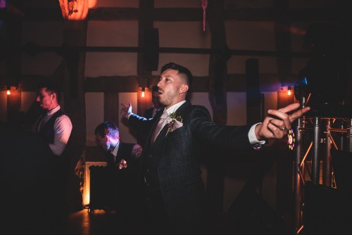 The groom dancing to the Wedding DJ at Barns and Yard at Hanley Hall in Gibert's End, Worcestershire