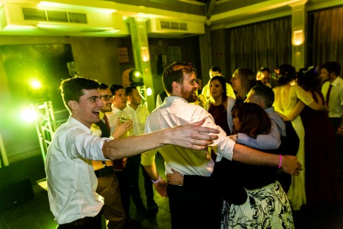 Large group of guests dancing to the Wedding Disco at Hampton Manor in Solihull