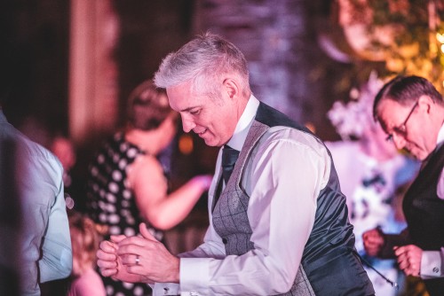 Groom dancing to the Mobile DJ at Shustoke Farm Barns in Warwickshire
