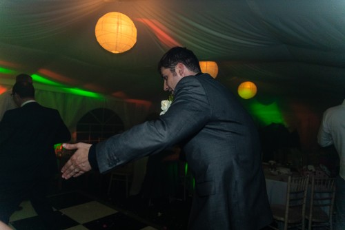 Groom dancing to the Wedding DJ at Whittington Cricket Club in Lichfield, Staffordshire