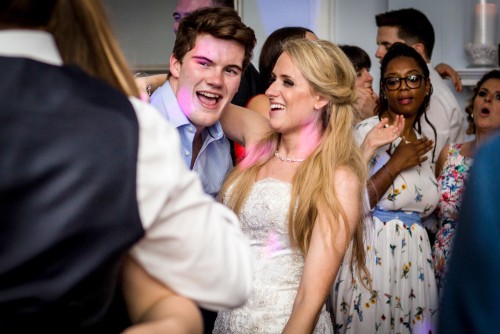 Bride having fun at Somerford Hall