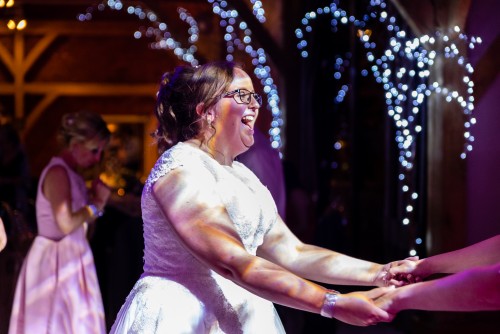 One of the Brides dancing to the Wedding DJ at Redhouse Barn in Bromsgrove, Worcestershire