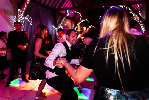 Guests dancing to the mobile disco at Redhouse Barn in Bromsgrove, Worcestershire